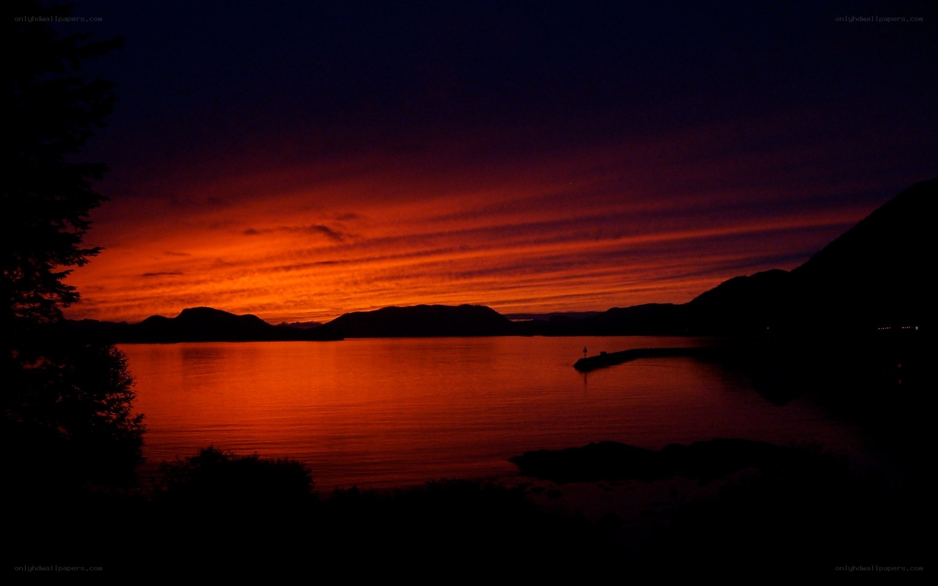 Vibrant sunset over a calm bay