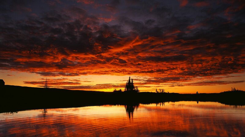 Vibrant sunset over a calm lake