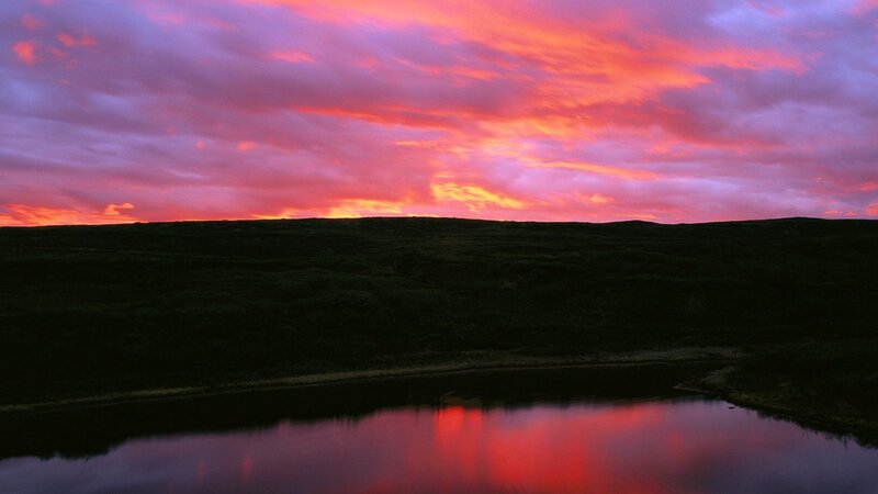 Vibrant sunset over a calm lake