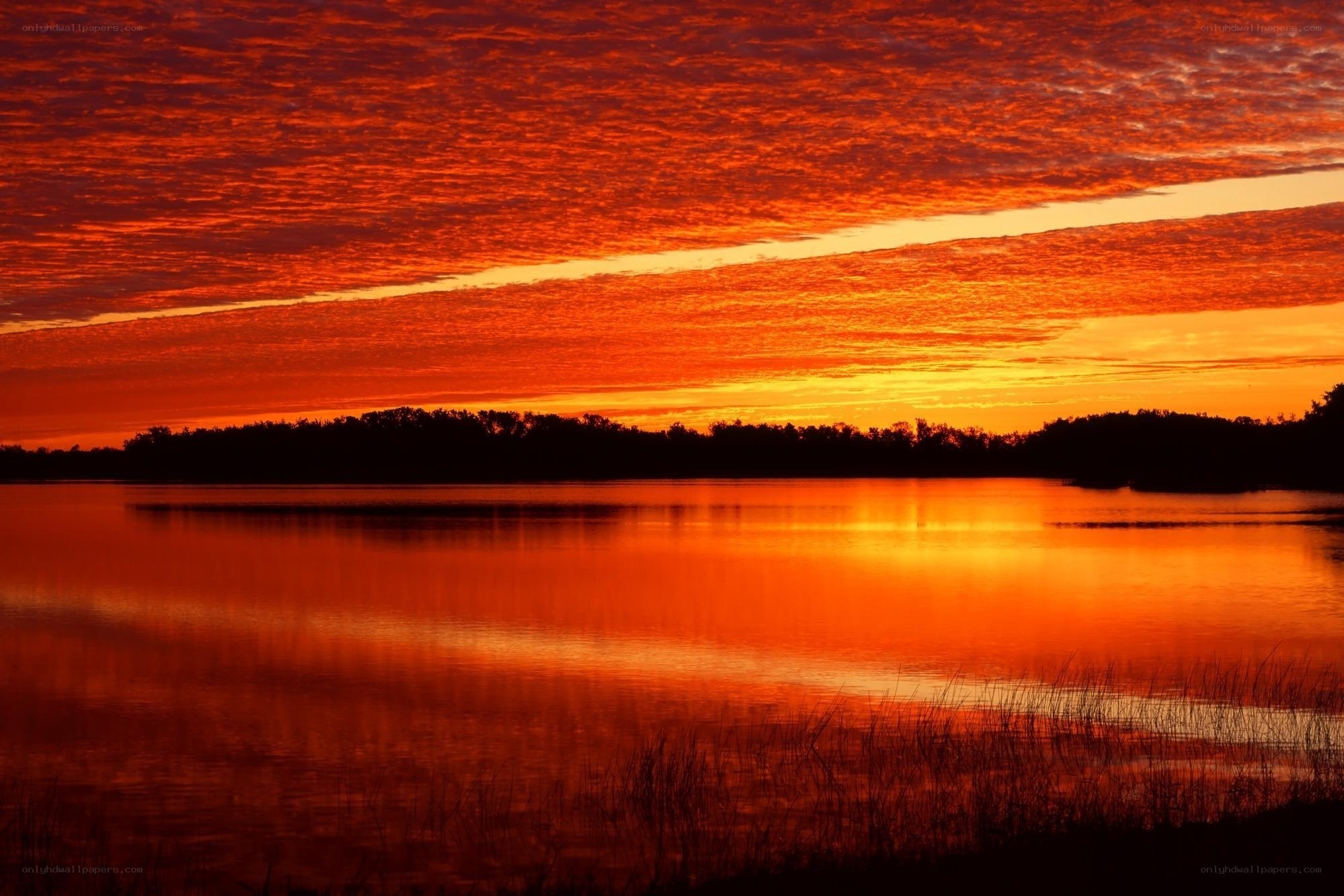 Vibrant sunset over a calm lake