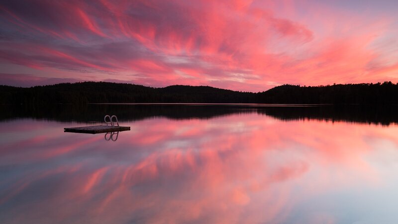 Vibrant sunset over a calm lake