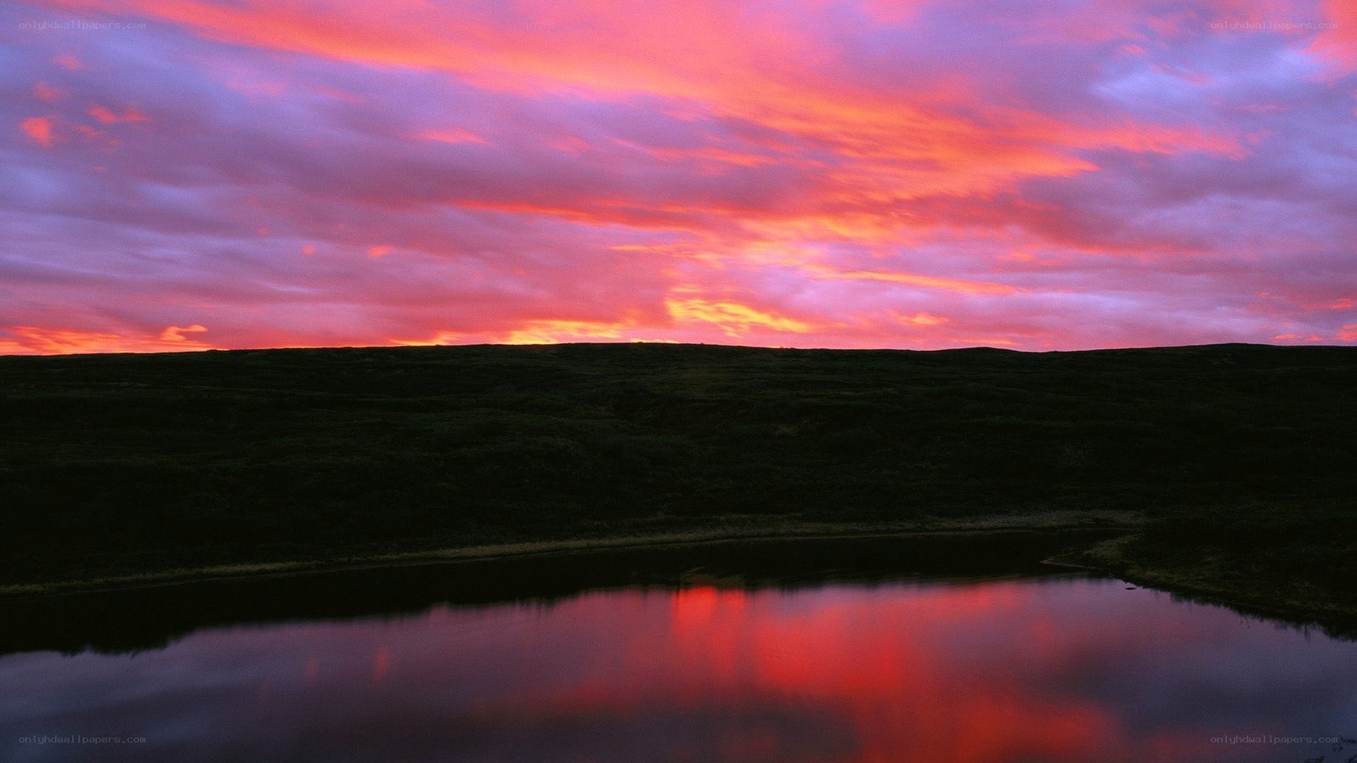 Vibrant sunset over a calm lake