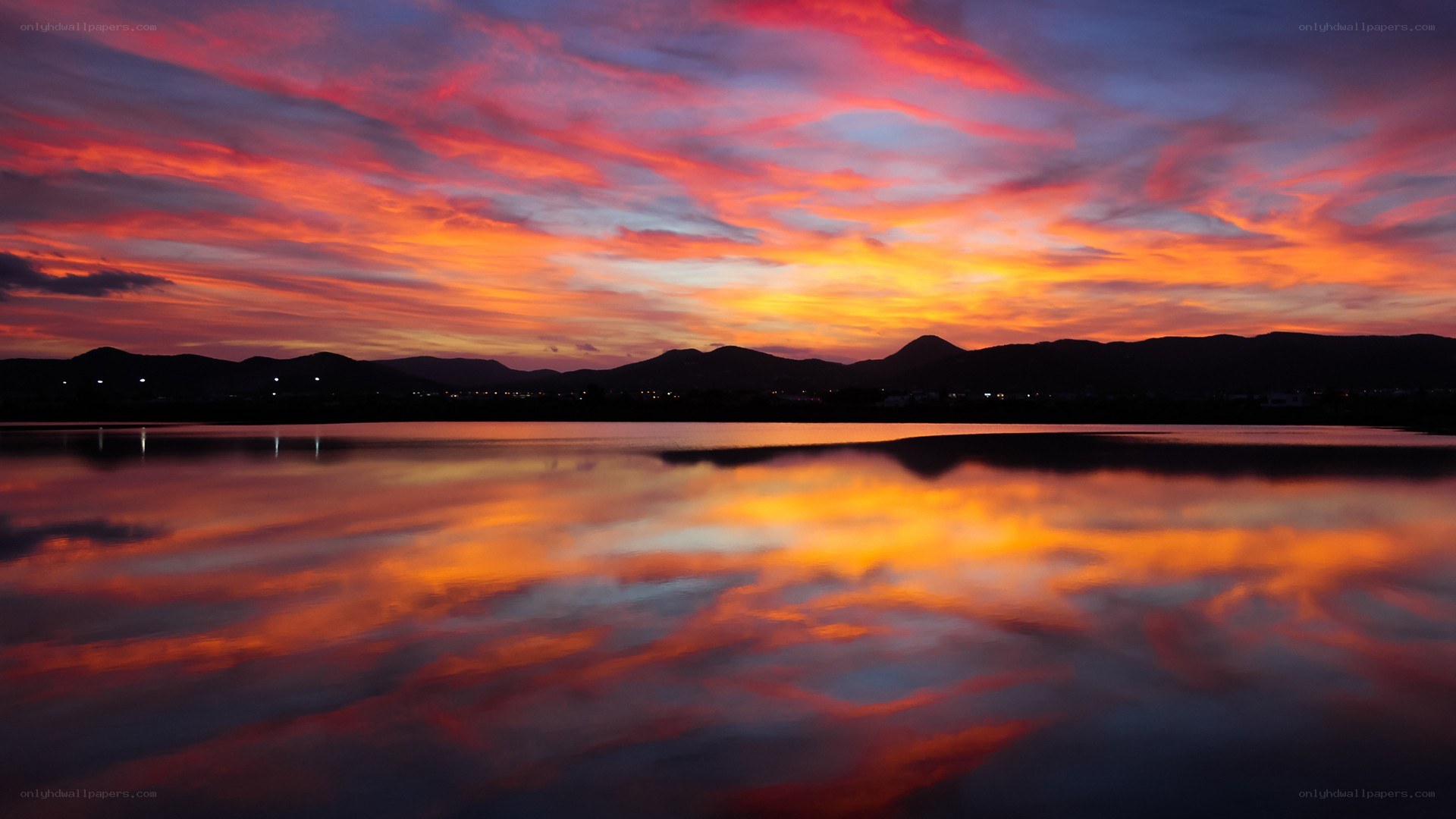 Vibrant sunset over a calm lake