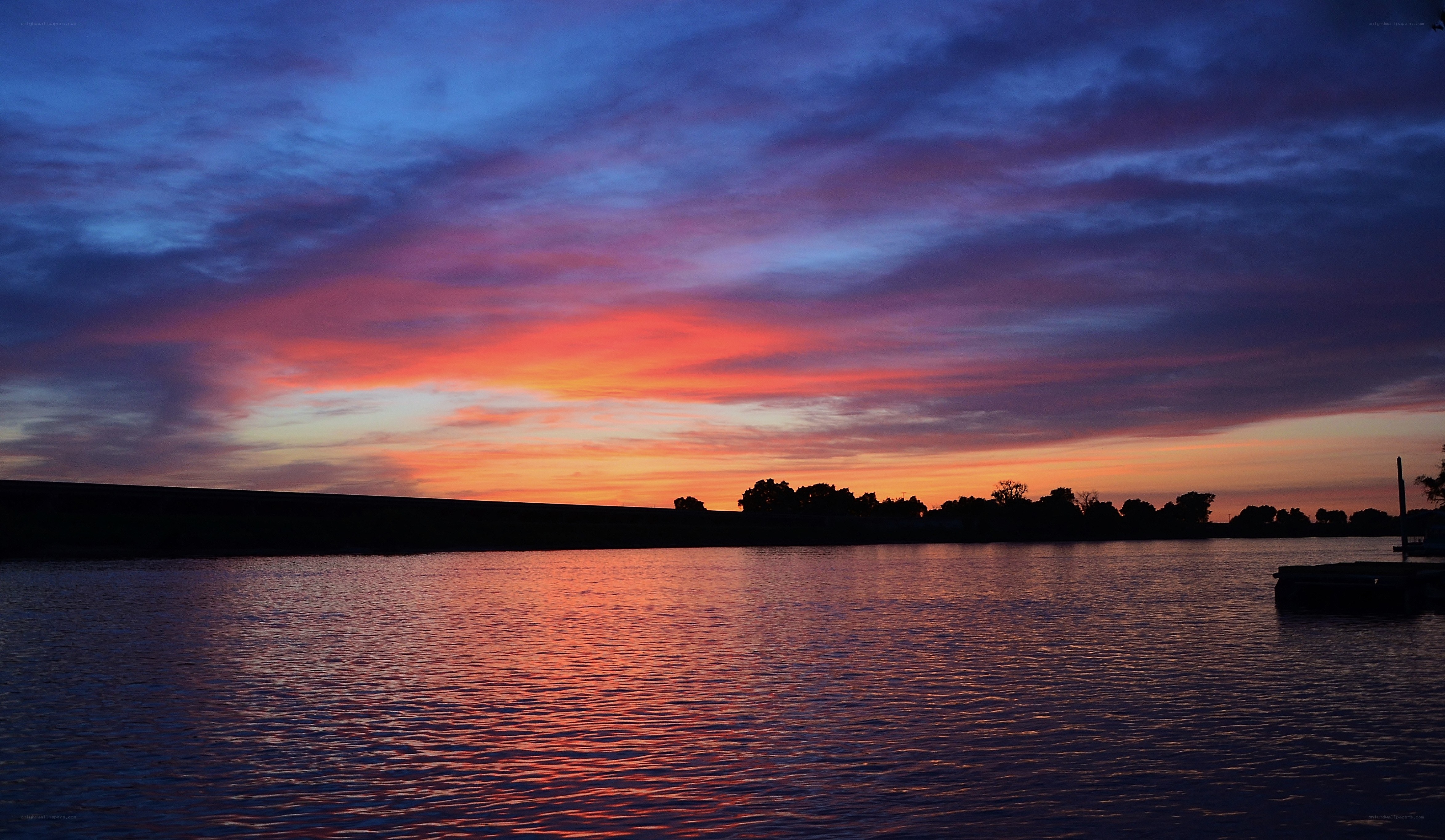 Vibrant sunset over a calm lake