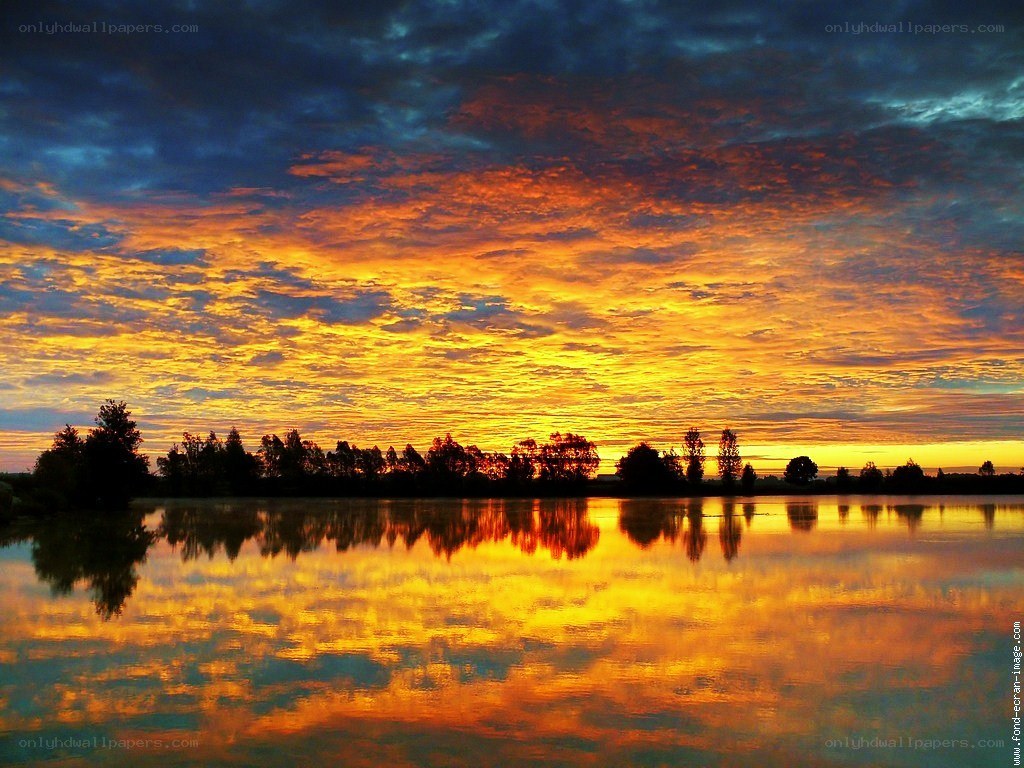 Vibrant sunset over a calm lake