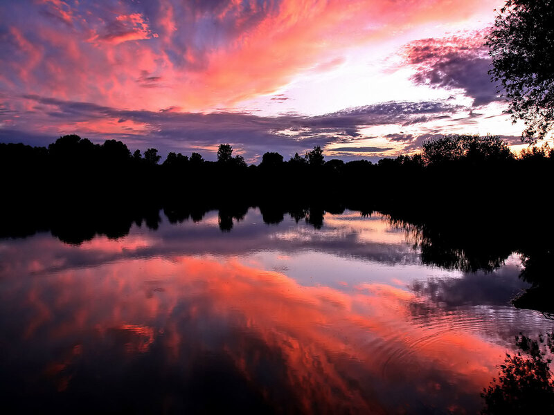 Vibrant sunset over a calm lake