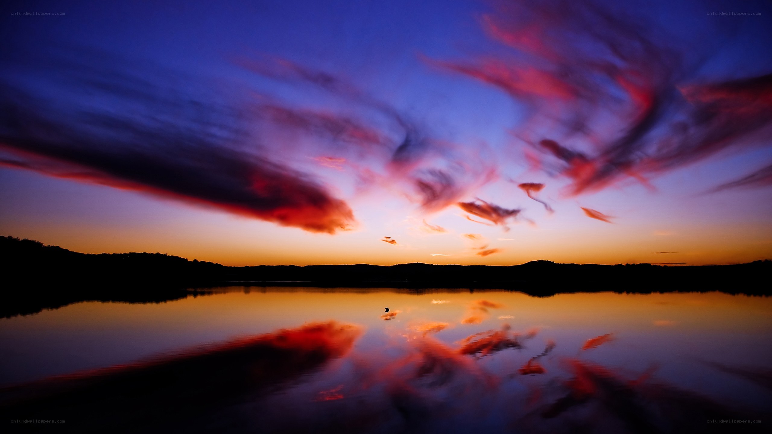 Vibrant sunset over a calm lake