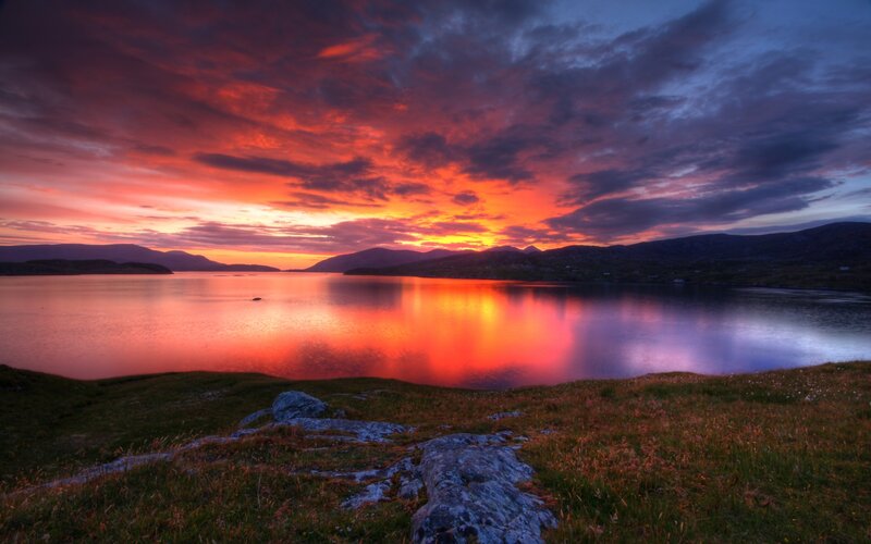 Vibrant sunset over a calm loch