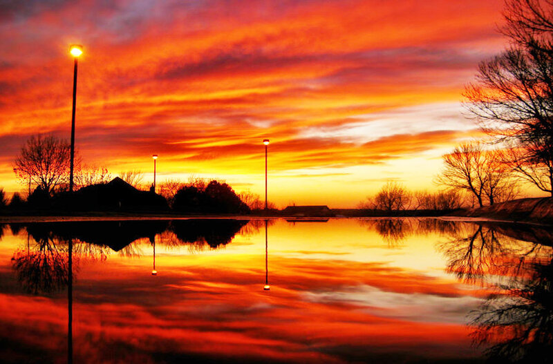 Vibrant sunset over a calm pond