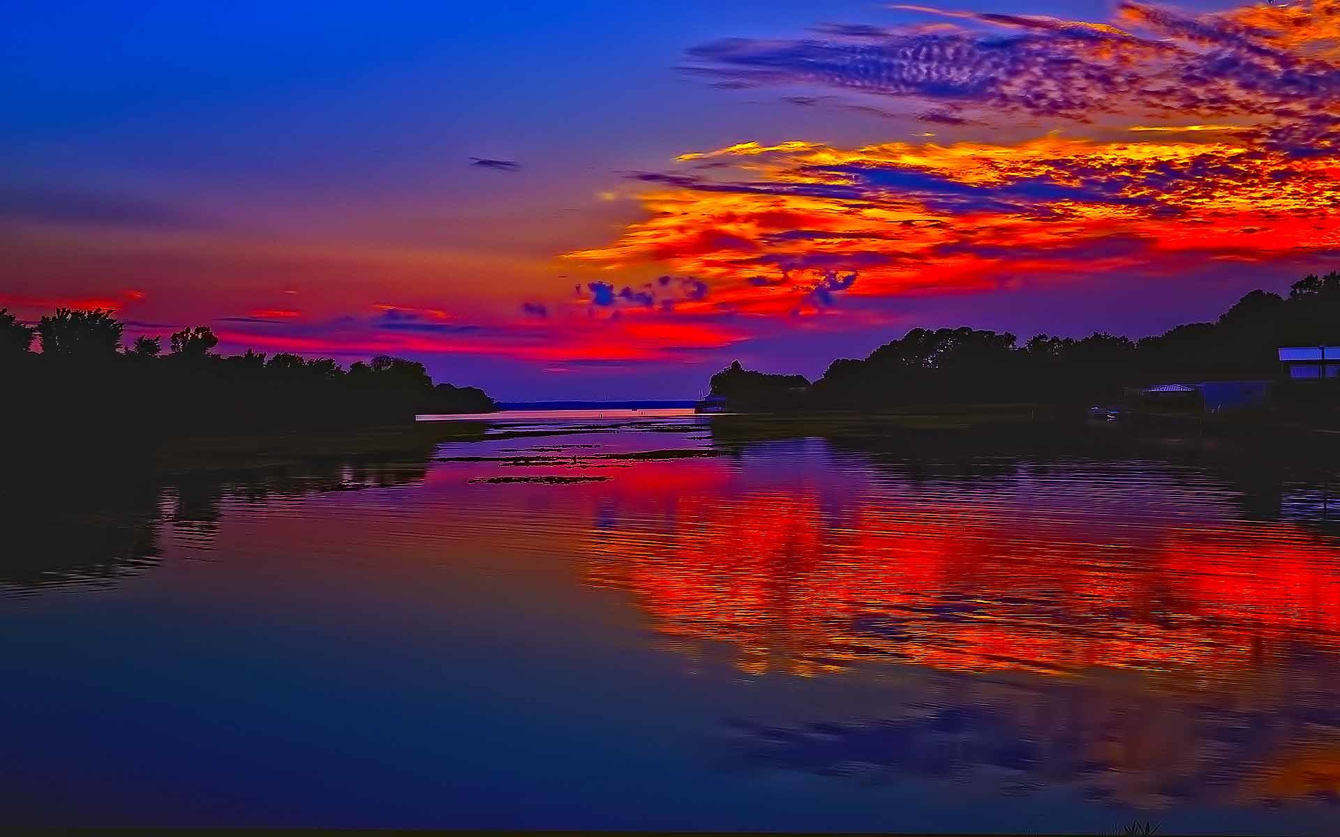 Vibrant sunset over a calm river