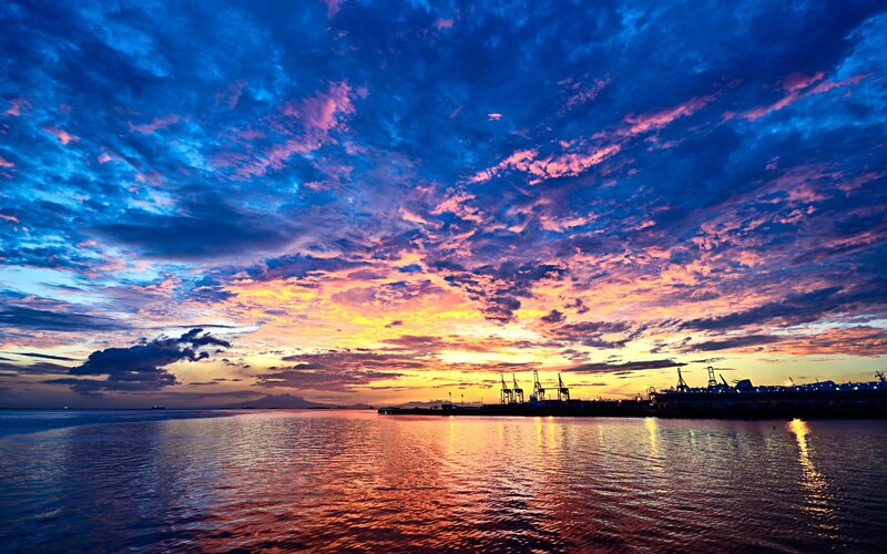 Vibrant sunset over a harbor