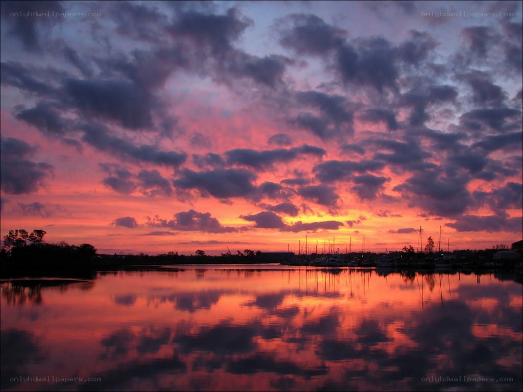 Vibrant sunset over a marina