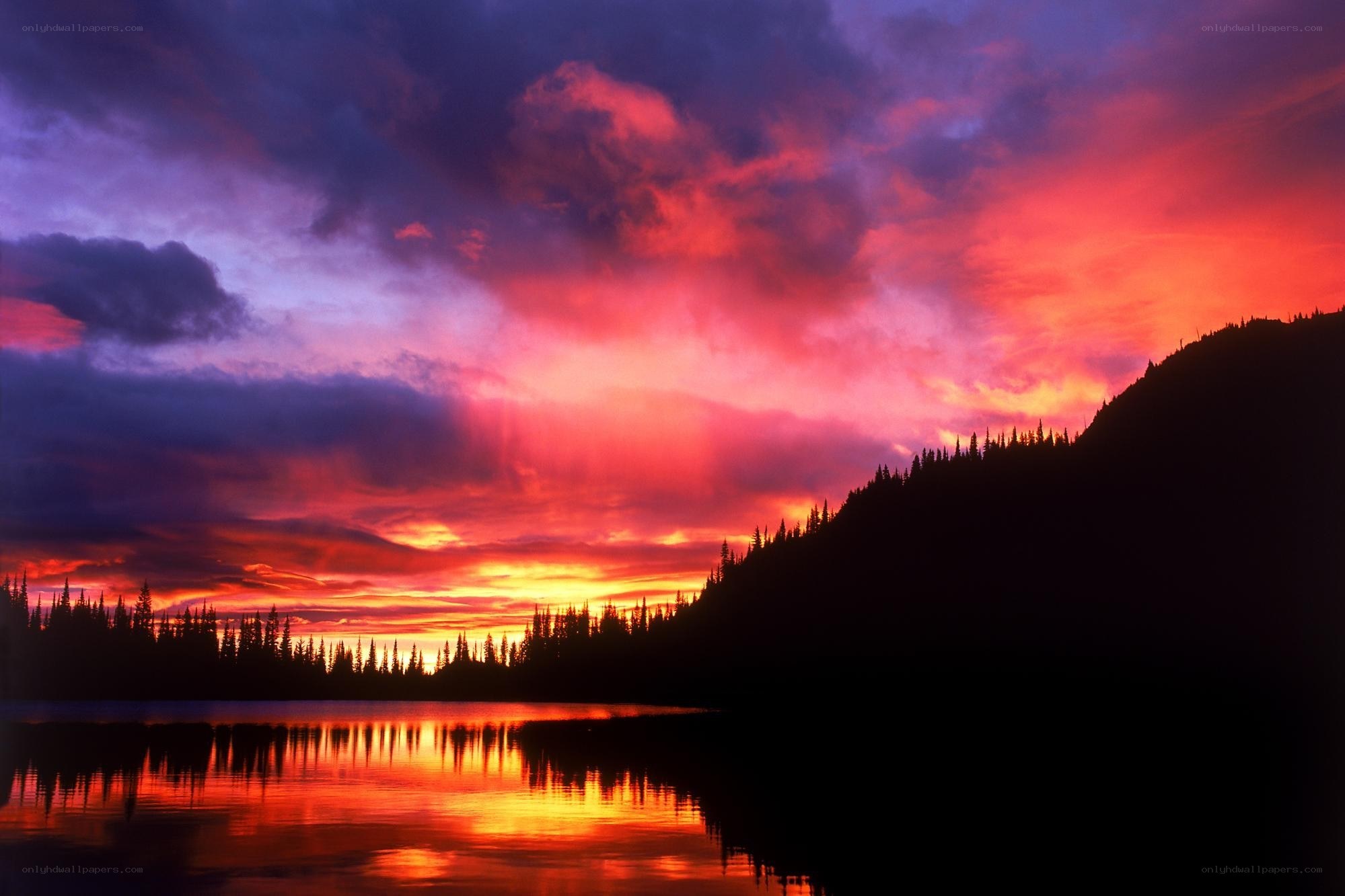 Vibrant sunset over a mountain lake