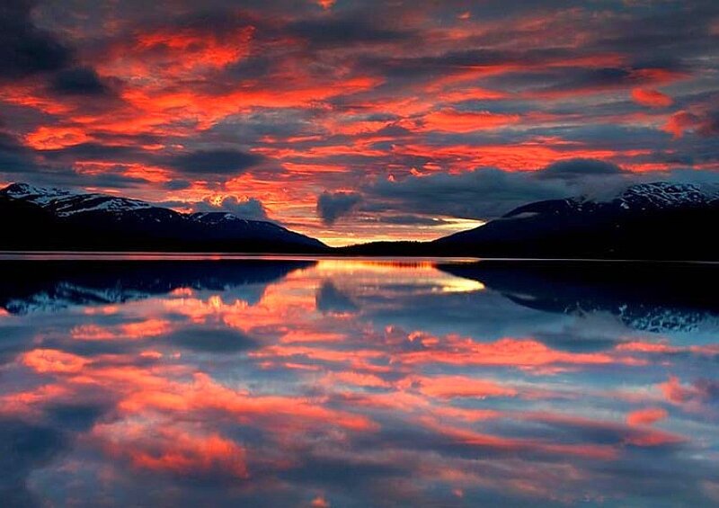 Vibrant sunset over a mountain lake