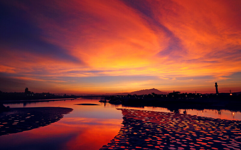 Vibrant sunset over a river