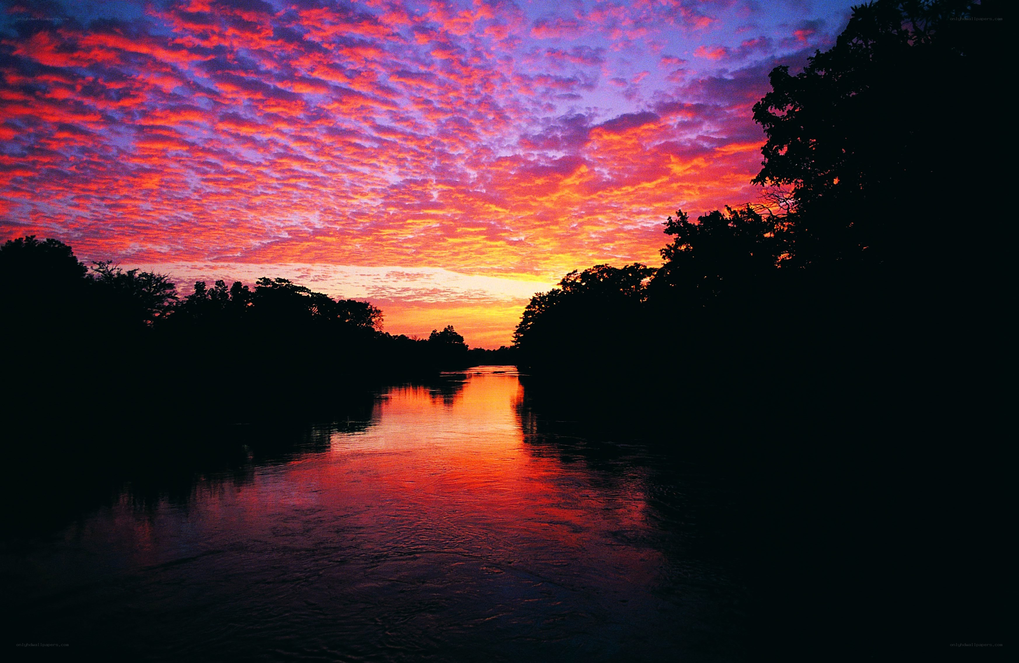 Vibrant sunset over a river
