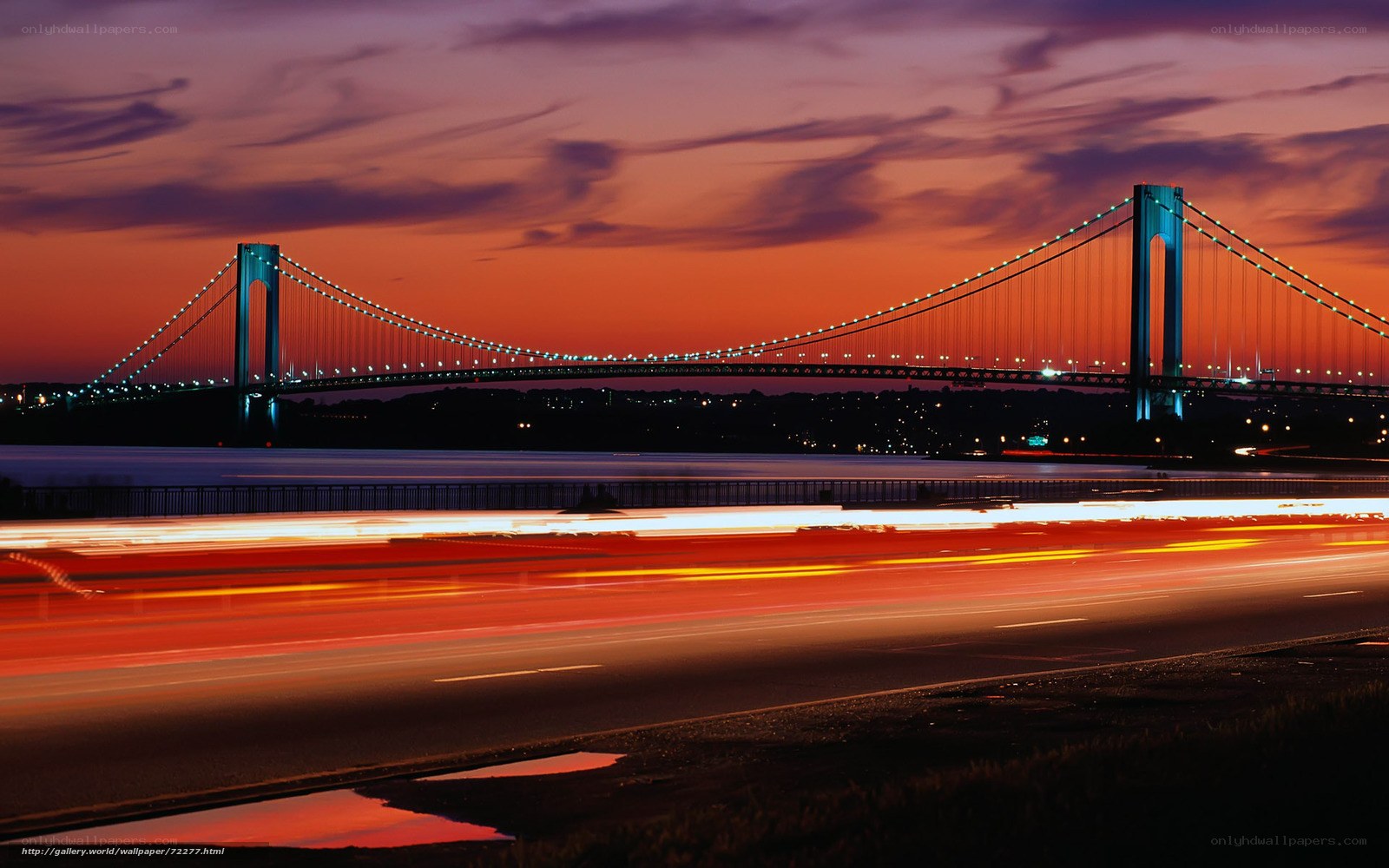 Vibrant sunset over a suspension bridge