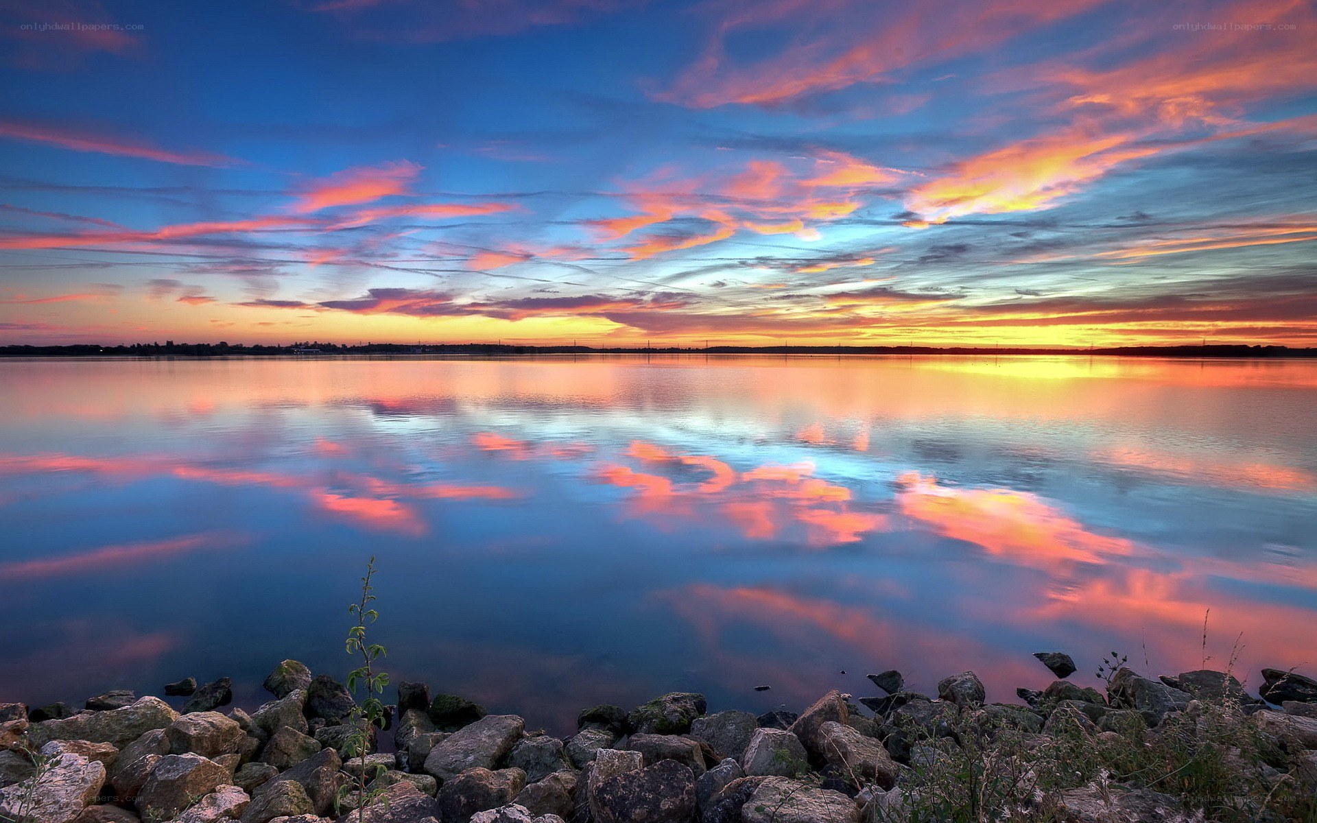 Vibrant sunset over calm lake