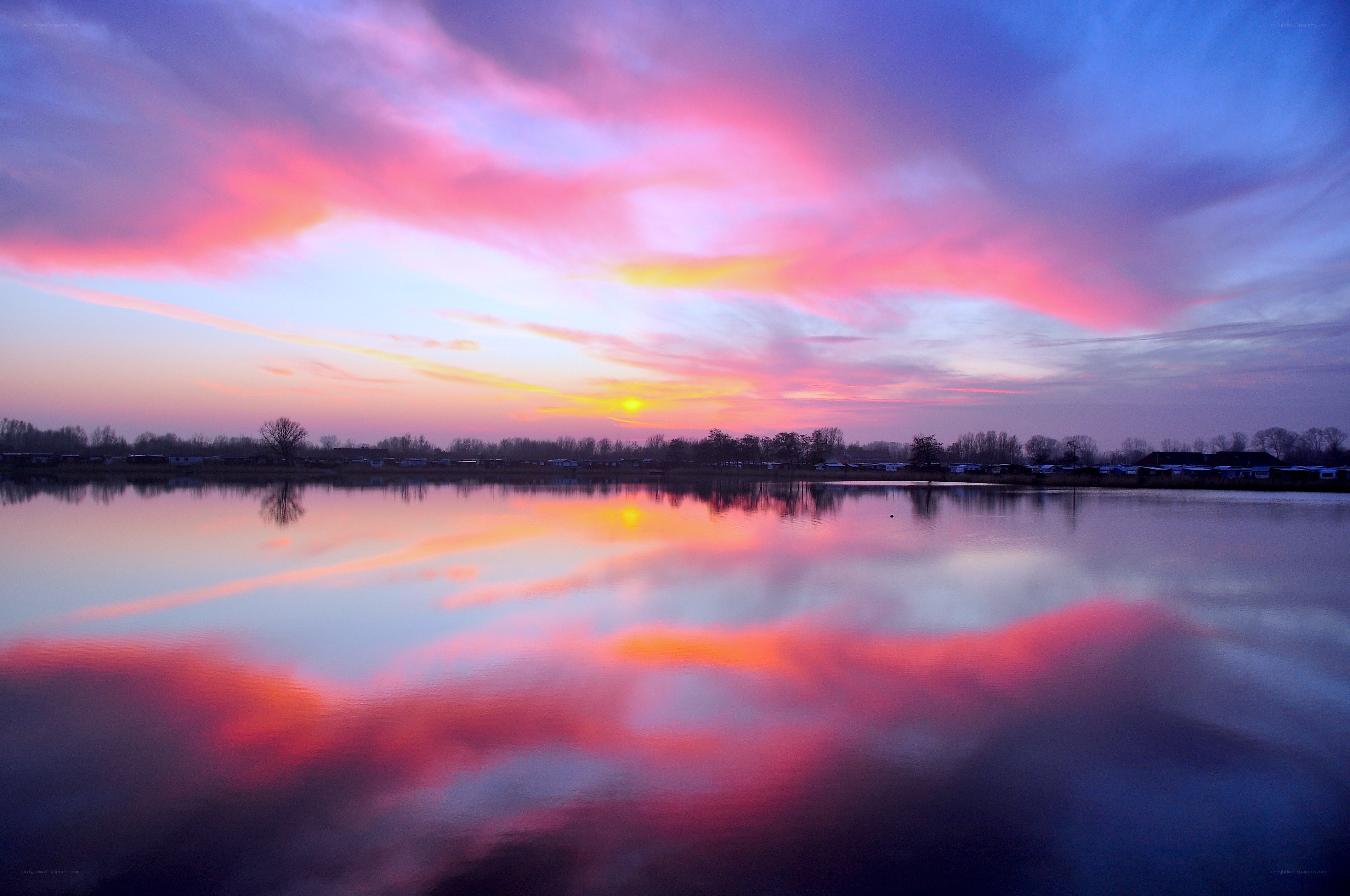 Vibrant sunset over calm lake
