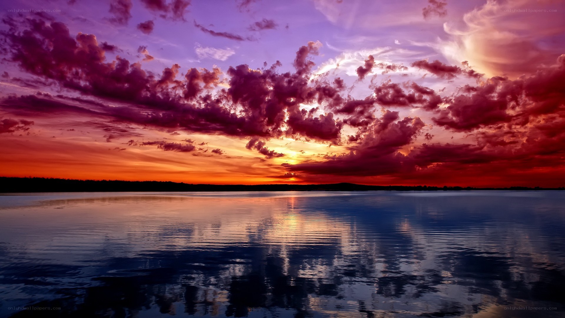 vibrant sunset over calm lake