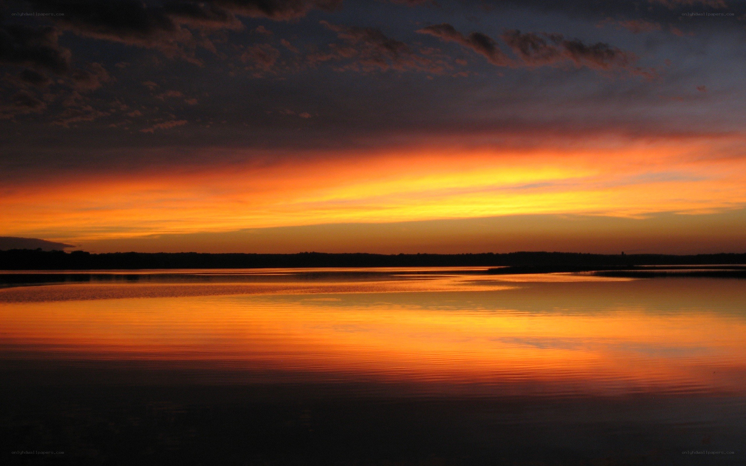Vibrant sunset over calm lake