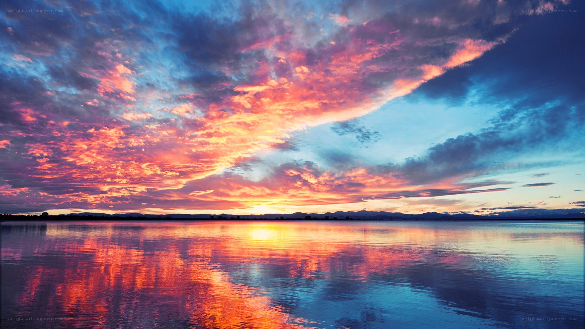 vibrant sunset over calm lake