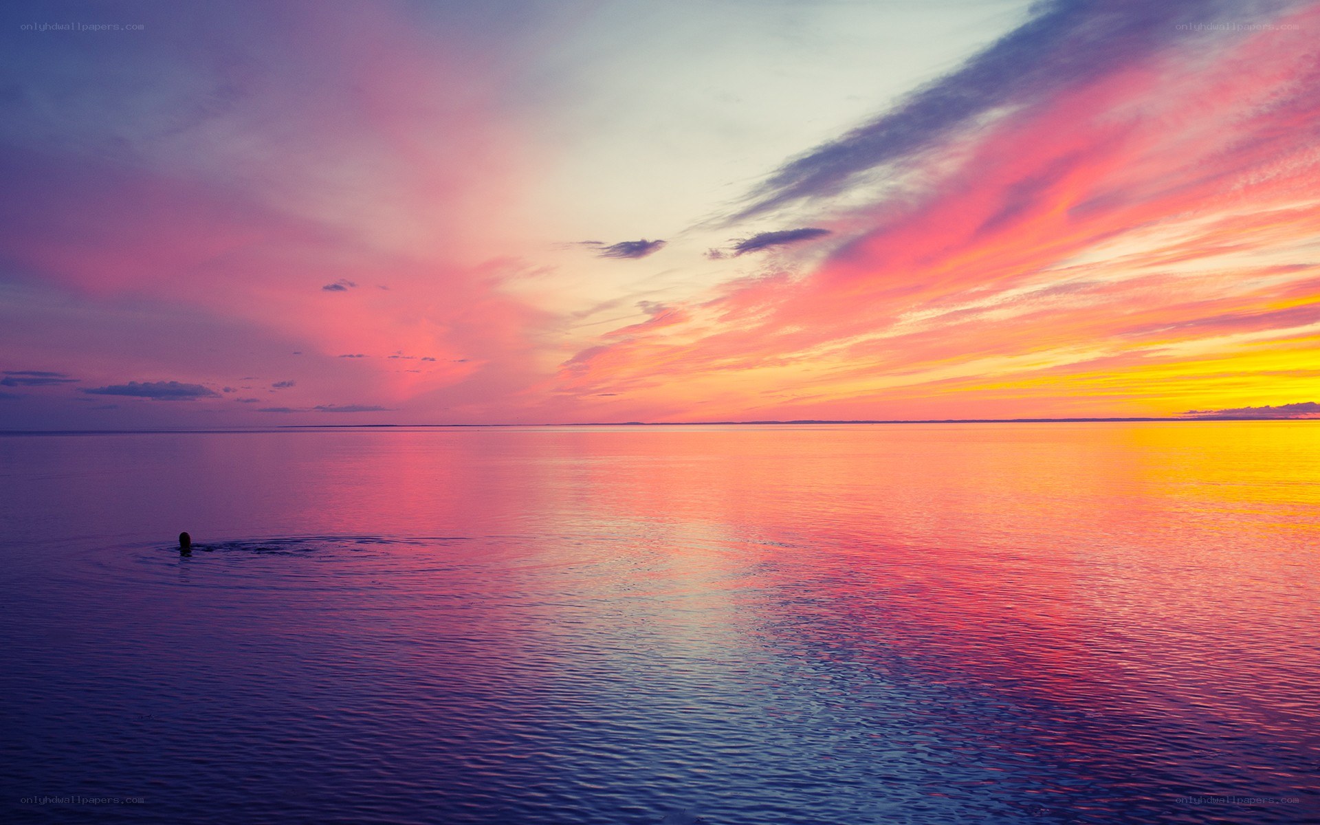 Vibrant sunset over calm water