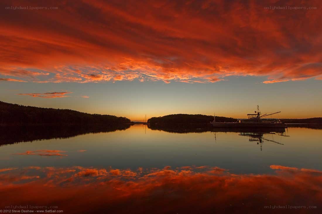 Vibrant sunset over calm water