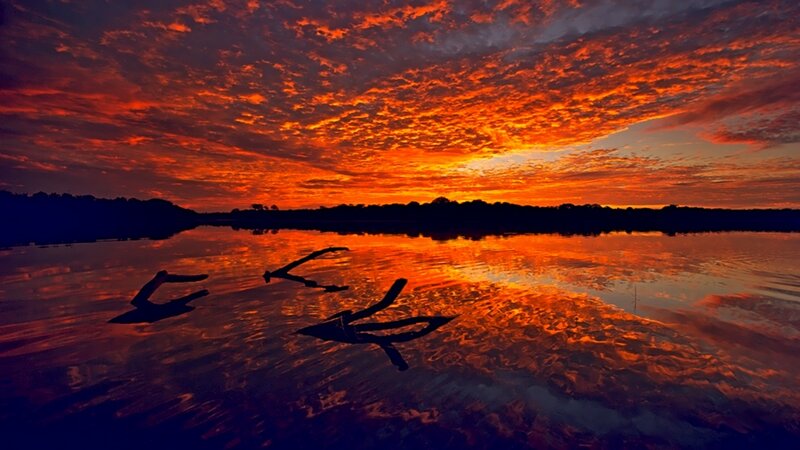 Vibrant sunset over calm water