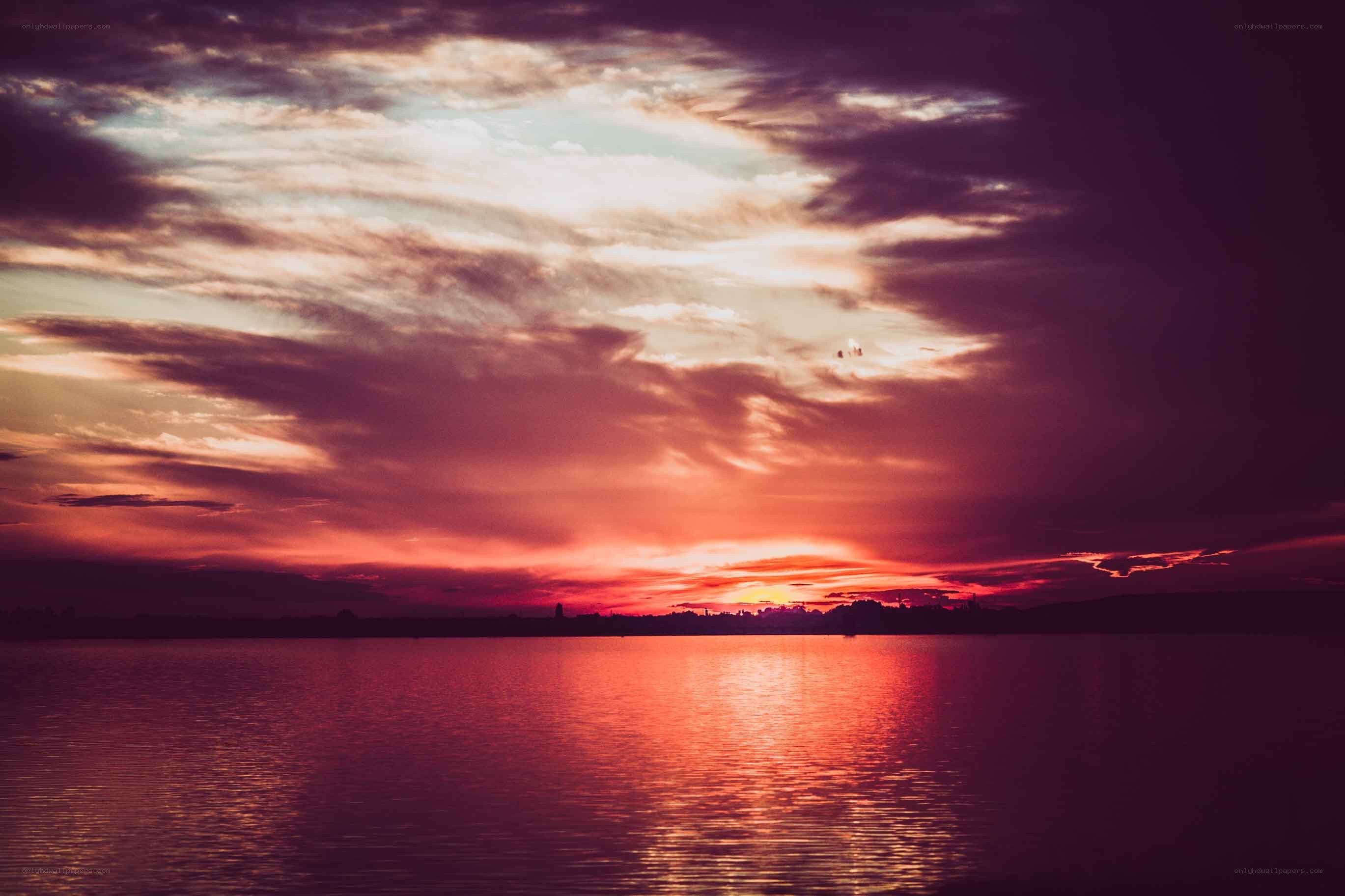 Vibrant sunset over calm water