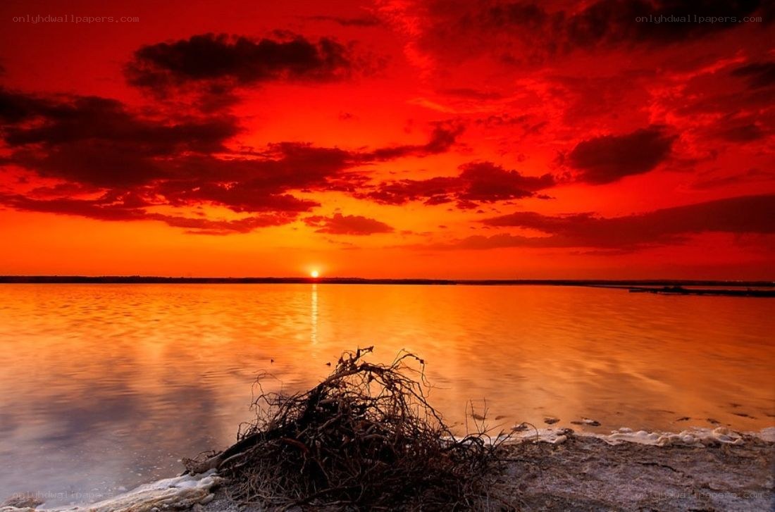 Vibrant sunset over calm water