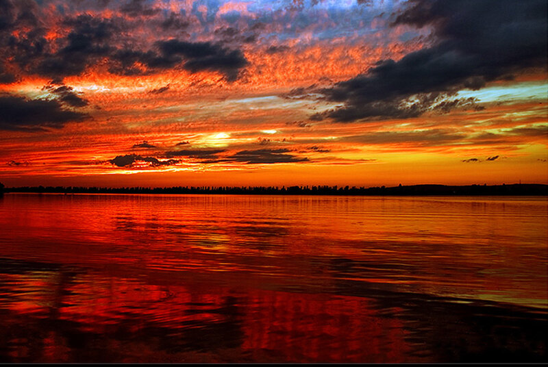 Vibrant sunset over calm water