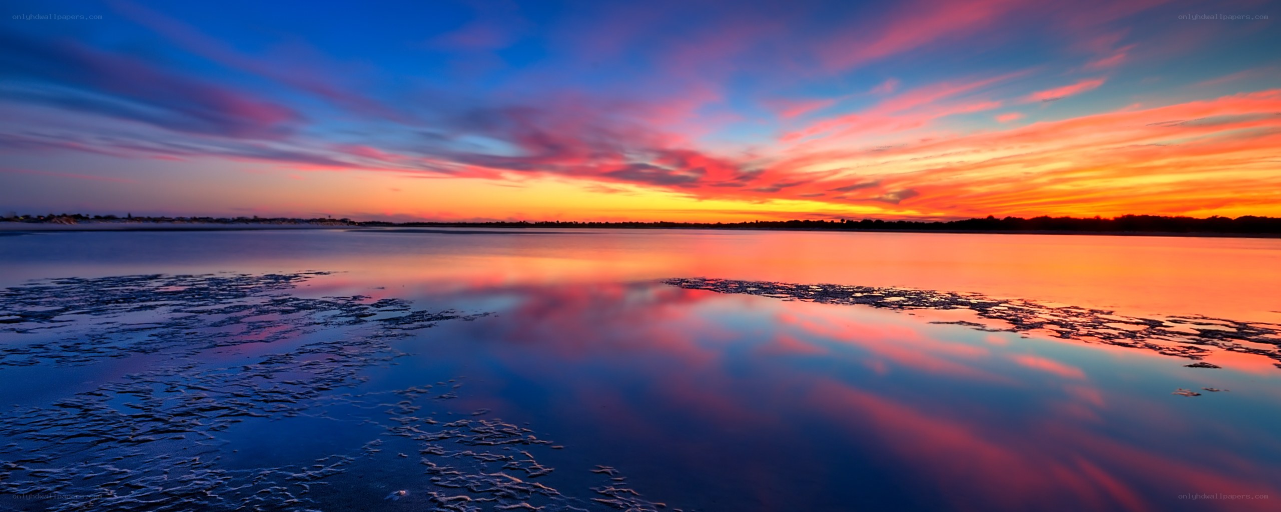 Vibrant sunset over calm water