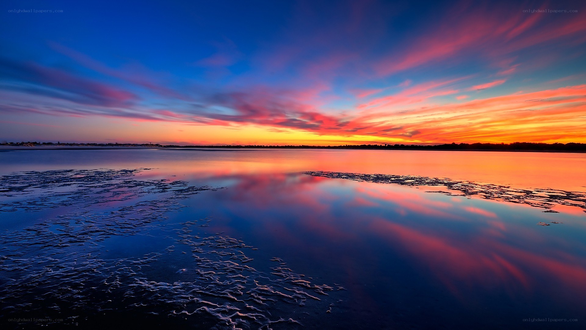 Vibrant sunset over calm water