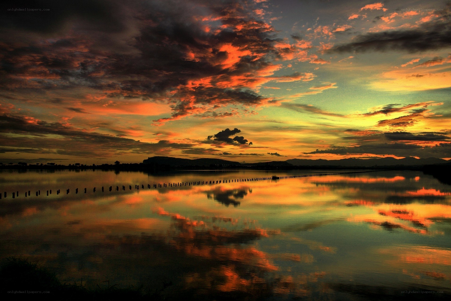 Vibrant sunset over calm water