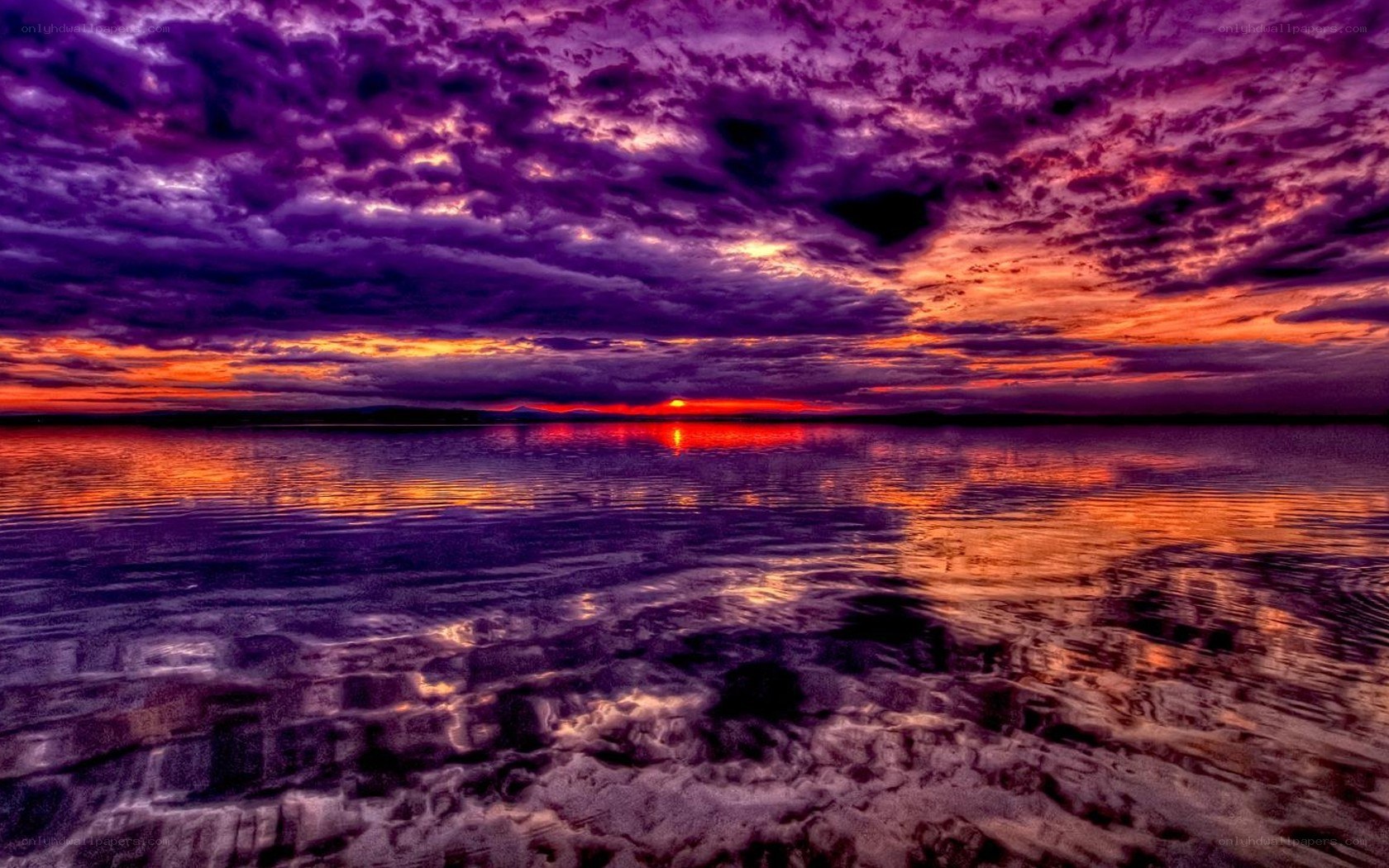 Vibrant sunset over calm water