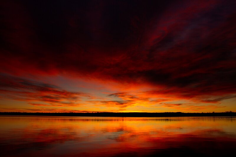 Vibrant sunset over calm water