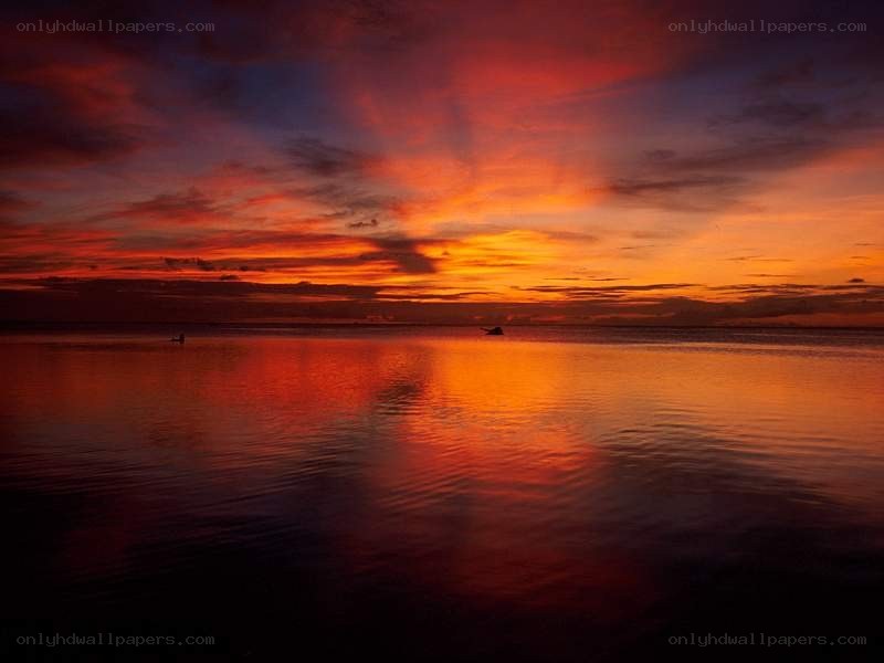Vibrant sunset over calm water