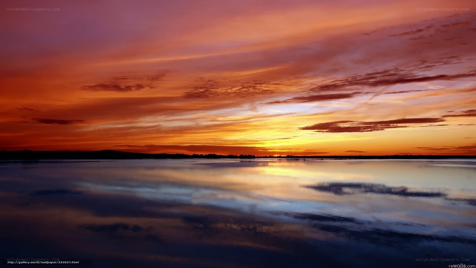 Vibrant sunset over calm water