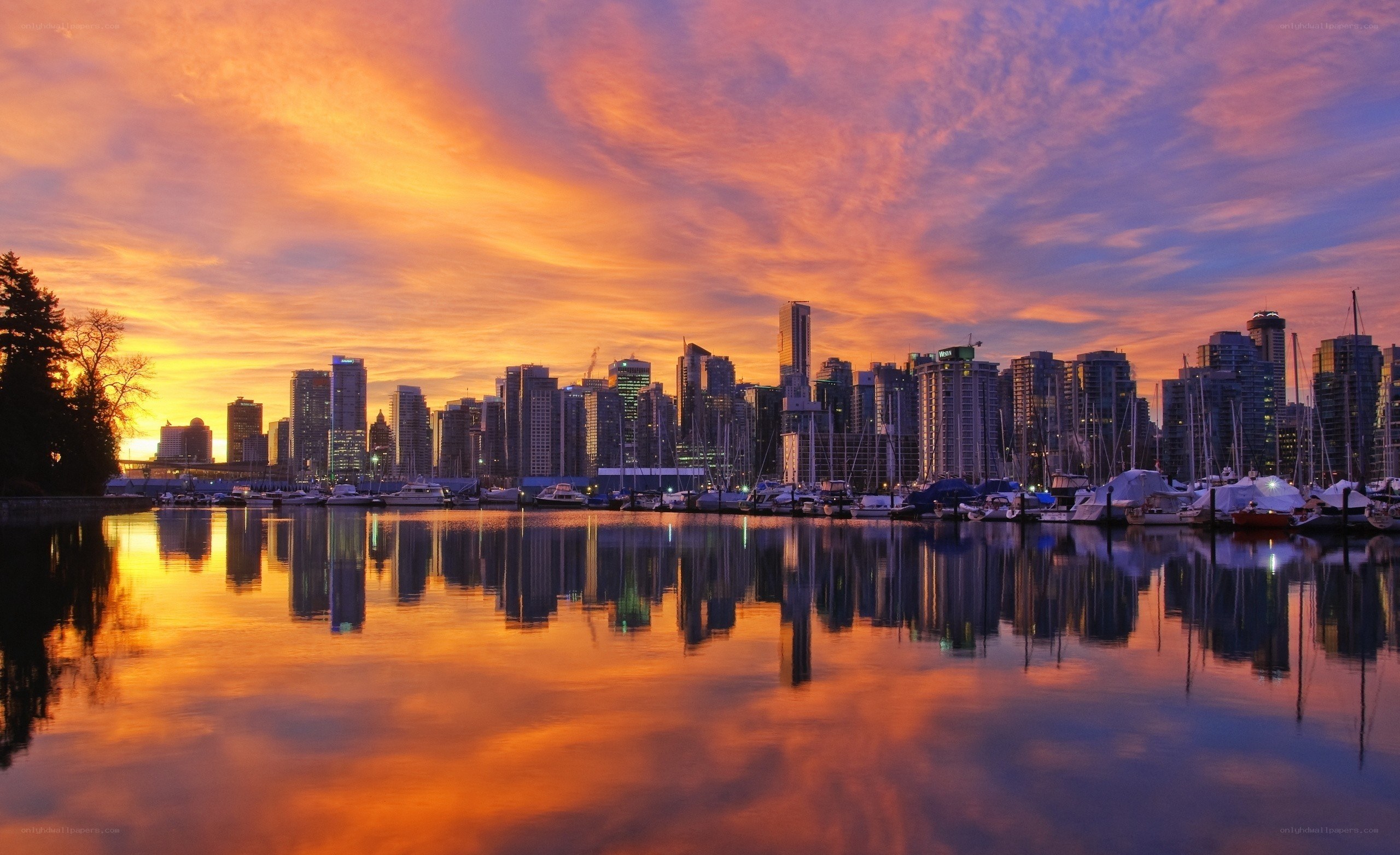 Vibrant sunset over city harbor