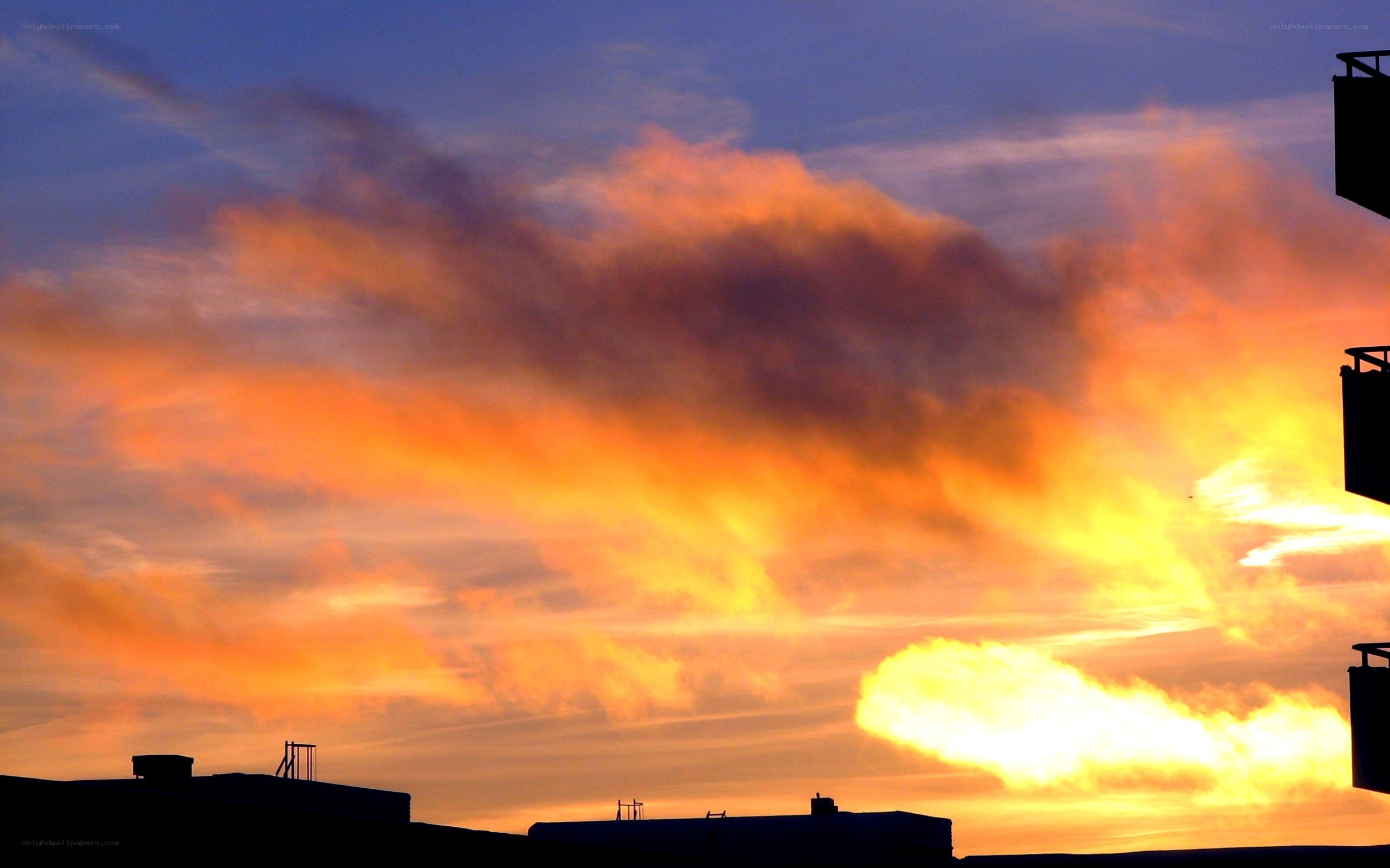 Vibrant sunset over city rooftops