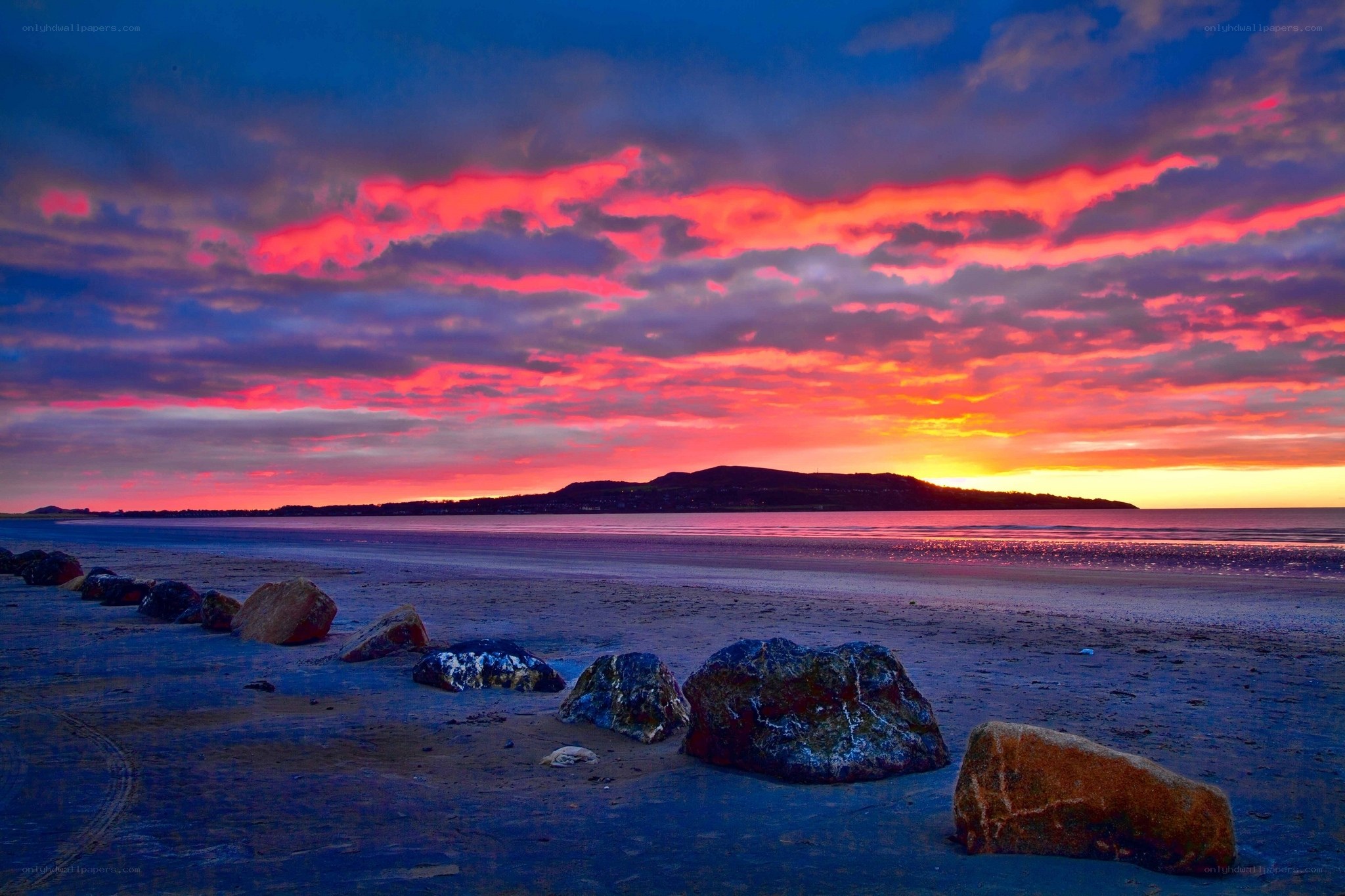 Vibrant sunset over coastal beach