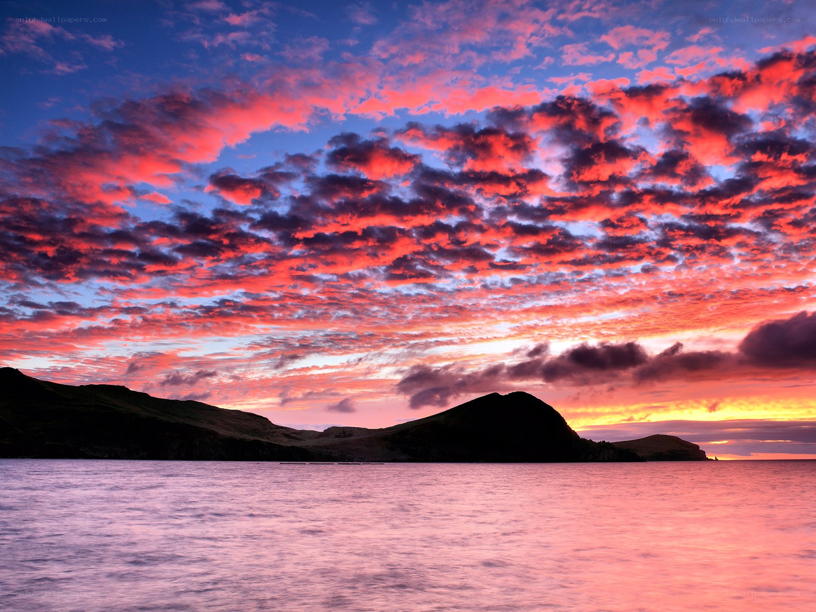 Vibrant sunset over coastal hills