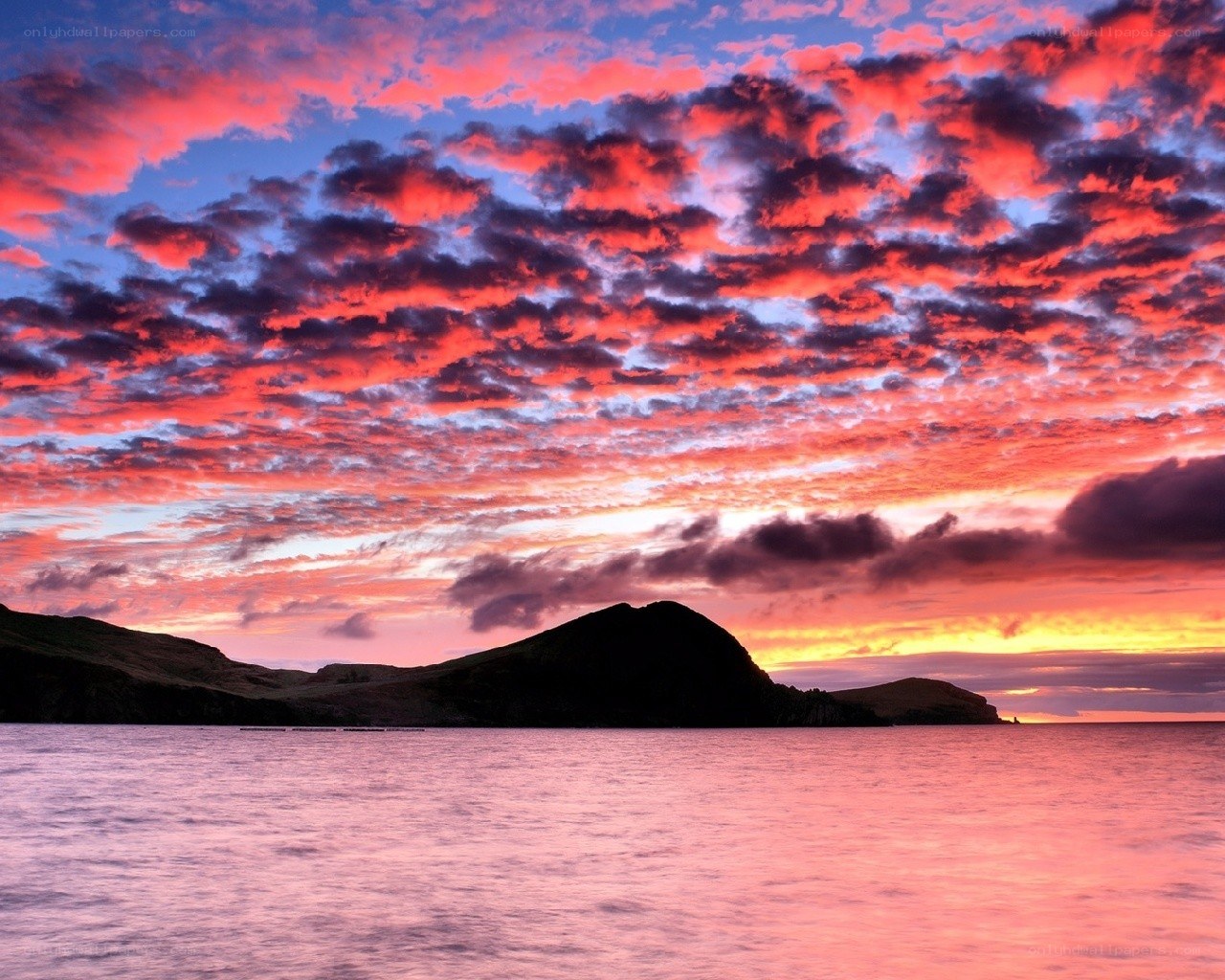 Vibrant sunset over coastal hills