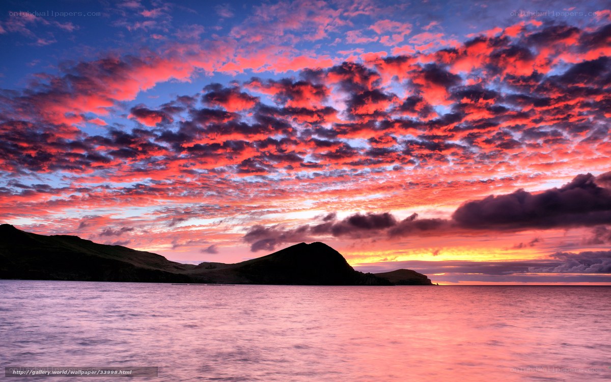 Vibrant sunset over coastal hills