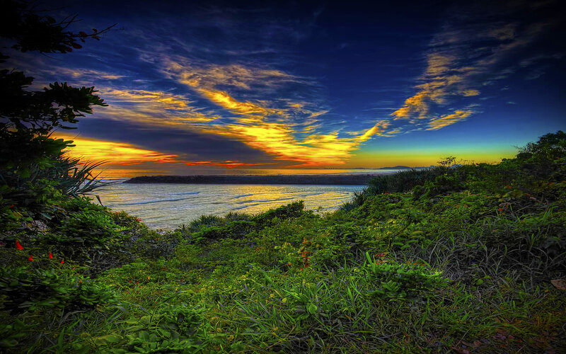 Vibrant sunset over coastal landscape
