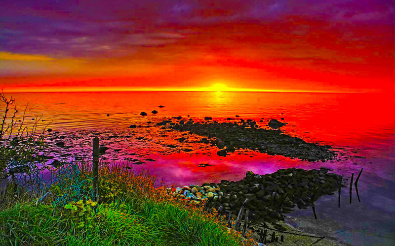 Vibrant sunset over coastal rocks