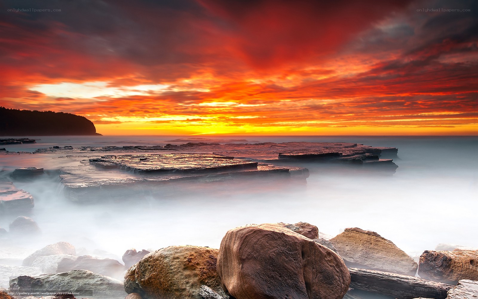 Vibrant sunset over coastal rocks