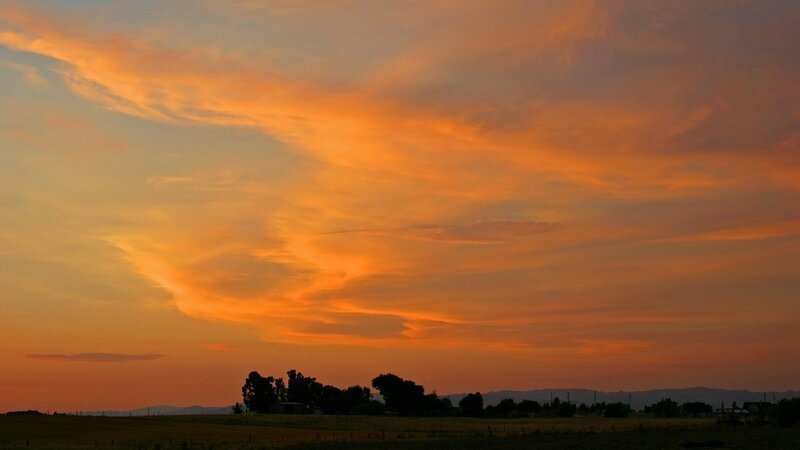 vibrant sunset over fields