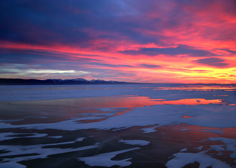 Vibrant sunset over frozen lake